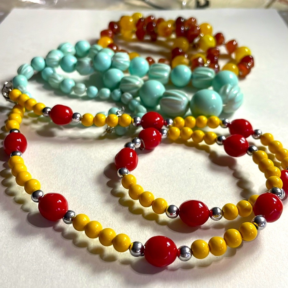 Group of three beaded necklaces. Fashion.